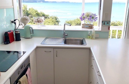 Red Beach House | Vintage Retro style Bach with stunning sea views