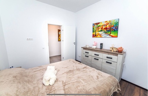 Tunari House | Welcome to GardenHideaway! Cozy stay with new furniture in a serene setting.