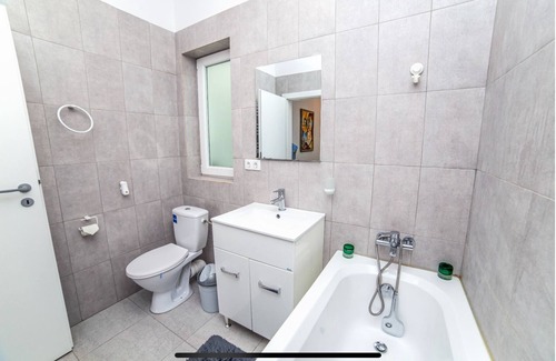 Tunari House | Welcome to GardenHideaway! Cozy stay with new furniture in a serene setting.