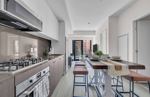 Eau Claire Apartment | Whispering Pines Retreat DT Getaway & Skyline Views