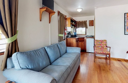 Hopkins Apartment | Wood cabana with a porch, pool view, WiFi, and a shared common area with grills