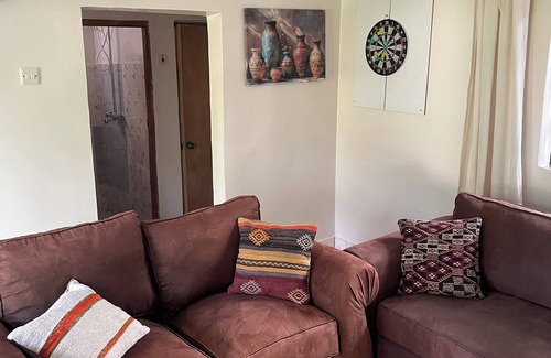 Busia Cabin | Your cozy farm cabin escape! Year-round birds, blooms & serenity.