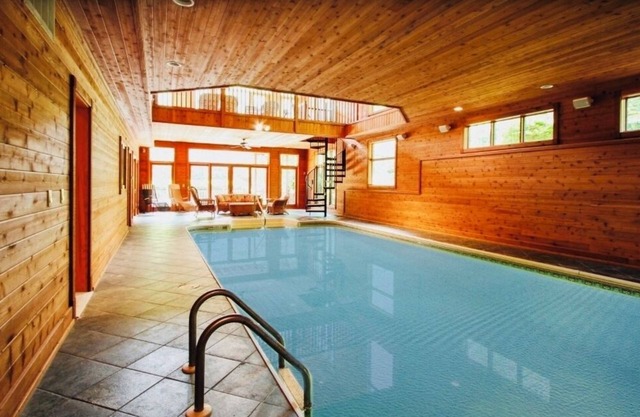 10,000 Sq. Ft. Home on 15 hunting acres with an in-door pool and sauna