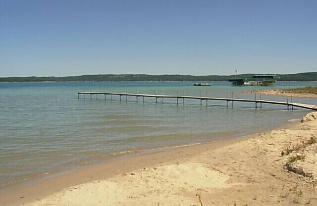 250 feet of sandy beach on Lake Charlevoix