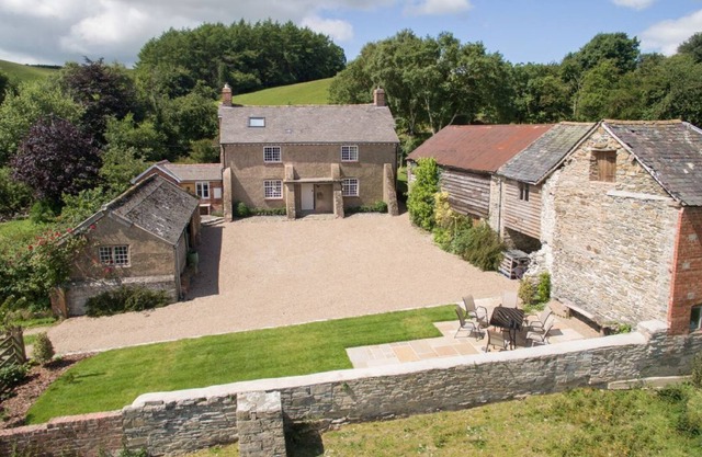 A beautifully refurbished detached farmhouse in an elevated position enjoying breath-taking unspoilt