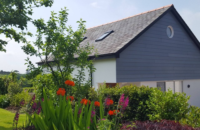 A luxurious spacious home, village location. 5 mins to the beach, EV Charger.