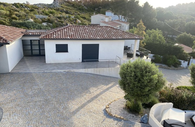 architect-designed villa on private estate. Swimming pool open with dates and times.