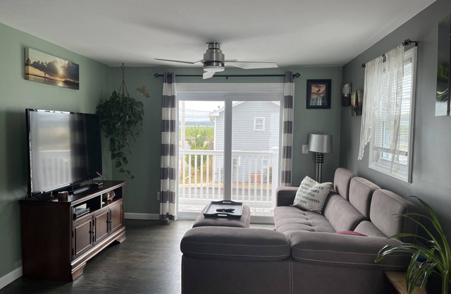 Beach Bum Bungalow offers stunning sunset marsh views just 400 ft to the beach.