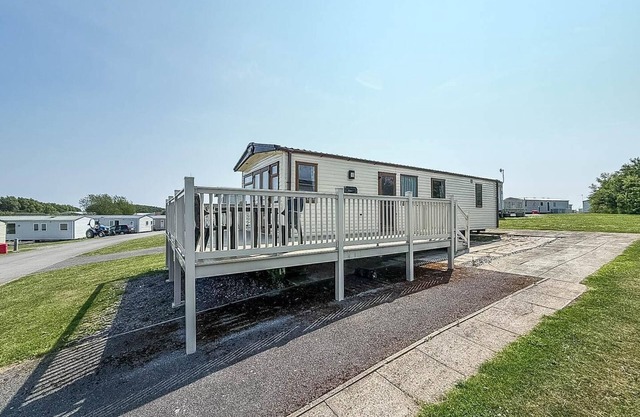 Caravan with a spacious decking area at Sand le Mere Park, Yorkshire ref 71062ME