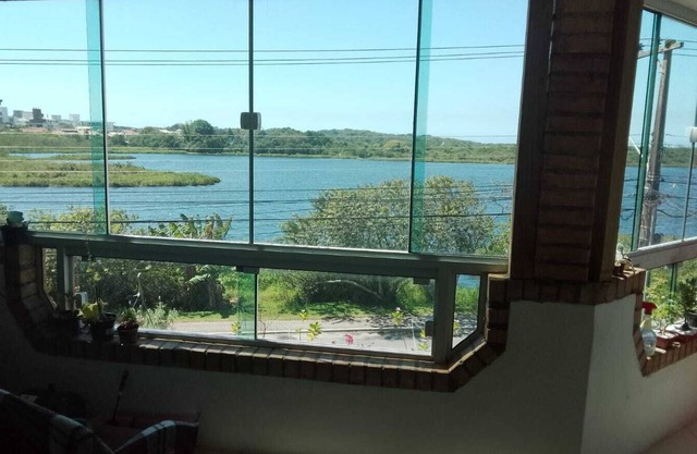 House in front of a small lake in Campeche