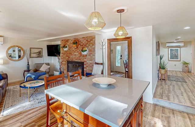 Lake view suite with beautiful setting, fireplace, firepit & tree-lined patio