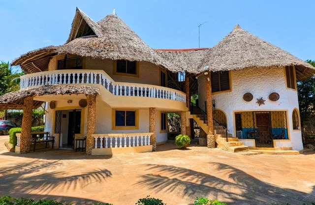 Modern Diani studio near Carrefour with pool; AC use via guest-paid tokens.nnnn