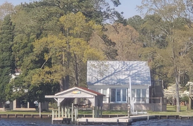 Modern Farmhouse Cottage on water with dock
