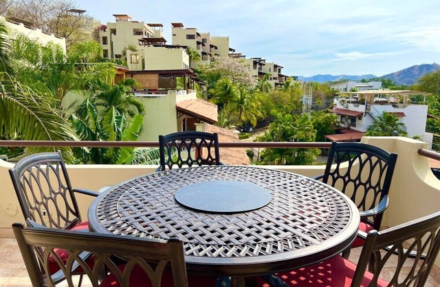 Rooftop Sunset Cove, This spacious and sunlit apartment features 2 bedrooms, 1.5 bathrooms, a stunning rooftop terrace