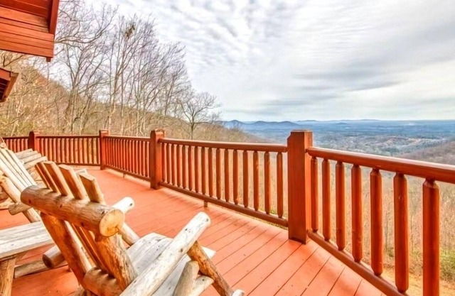 Rustic mountain-view home with deck, fire pit, hot tub, fireplace, & game room