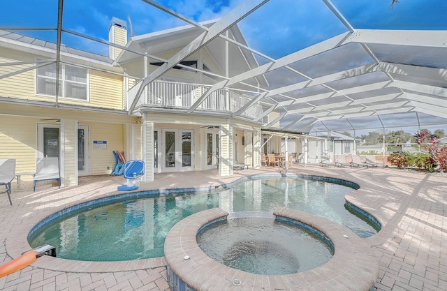 Spacious 4BR Riverside Retreat with Pool & Hot Tub