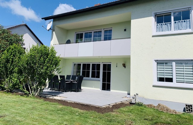 Sunny modern apartment with a very large terrace, quiet location and mountain view