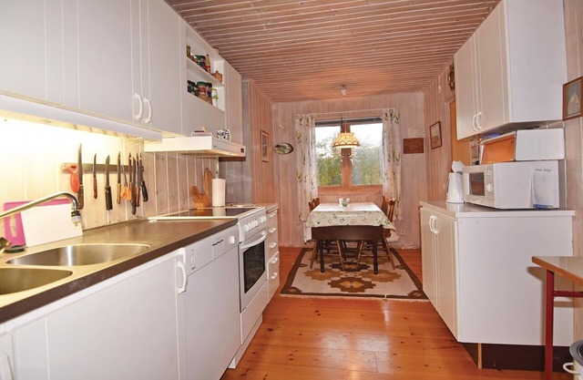 The house is located on the edge of an established vacation home settlement.