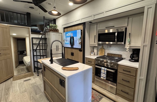 Tiki "Glamping" unit fully stocked RV w/golf cart