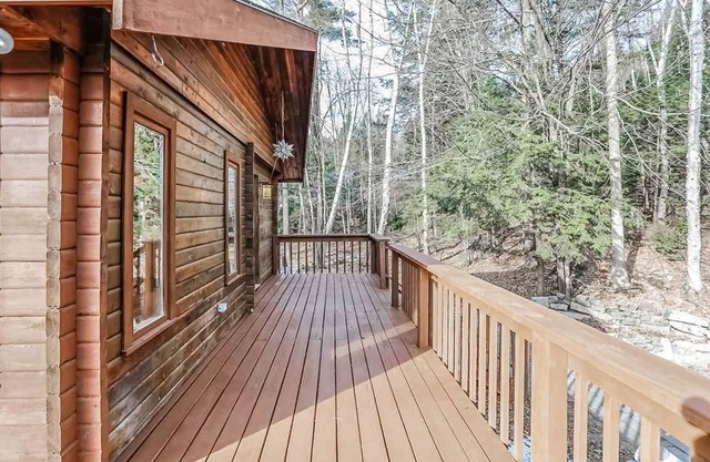Tranquility, stone fireplace, lofted ceilings, wall of windows, & views