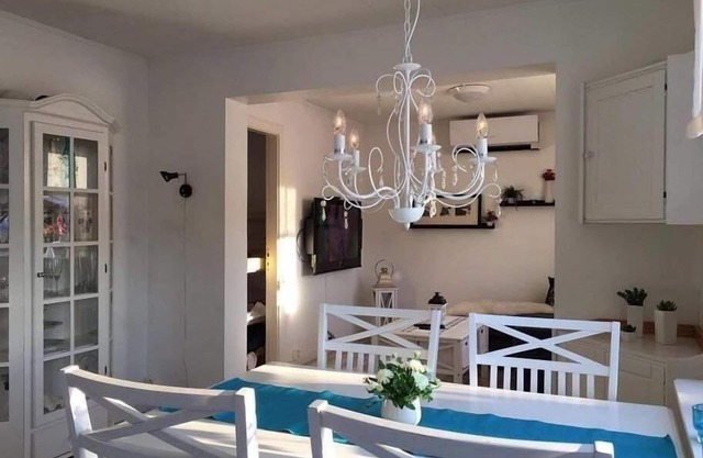 Wooden house with a terrace and a sauna, amidst a wonderful natural landscape