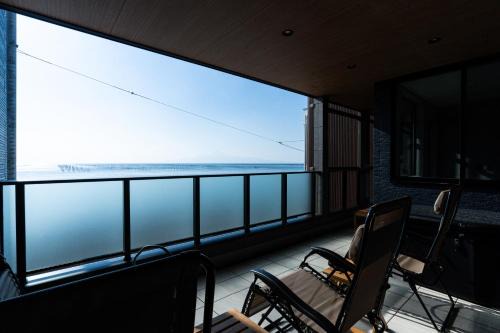 Nishi Ward Apartment | みらいステイKAWACHI サウナspaや温泉付き-絶景オーシャンビューを満喫