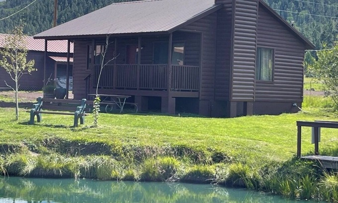 Greer Cabin | 2 BR-1BA Log Cabin on Main Street. Stocked trout pond, porch, dogs ok.