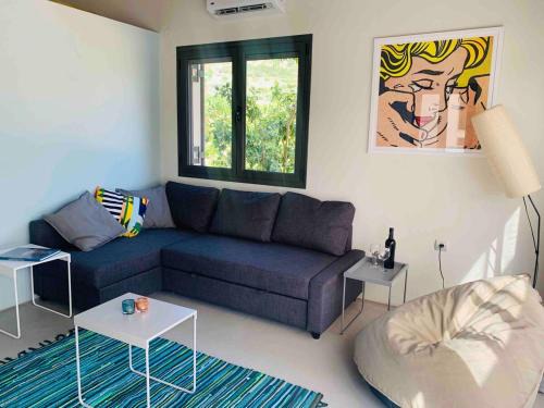 Archangelos Apartment | A designed loft studio a minute walk to the beach