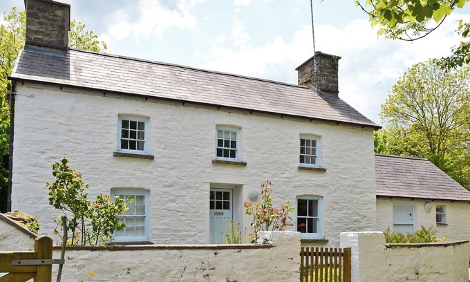 New Quay Cottage | A detached character cottage with beams, wood burner and enclosed garden.