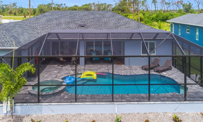 Pine Valley House | ALL the amenities! New home with hot tub, on canal, dock, pool heat included!
