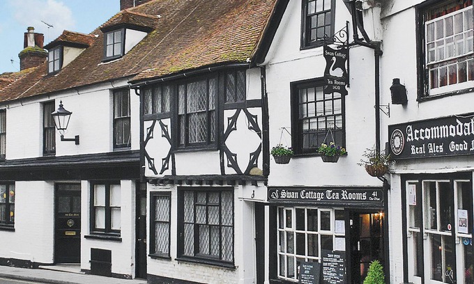Rye Cottage | An unusual two-storey apartment with beams and an open fire.