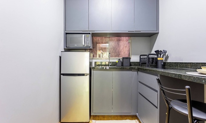 Vila Planalto Apartment | APARTMENT 5 MINUTES FROM THE AIRPORT WITH AIR CONDITIONING AND BALCONY