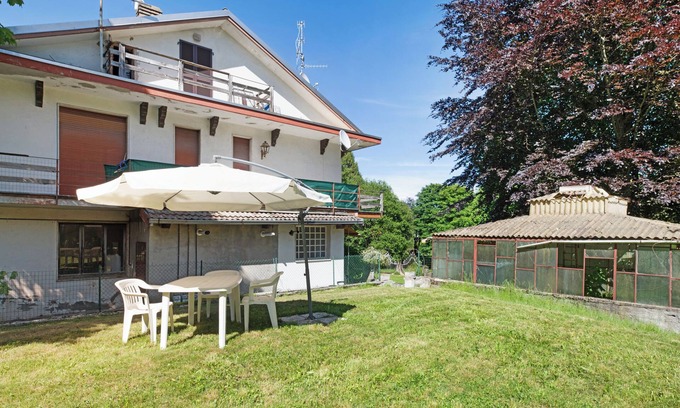 Lanzo d'Intelvi Apartment | Apartment 'Immerso Nel Verde' with Mountain View and Private Garden