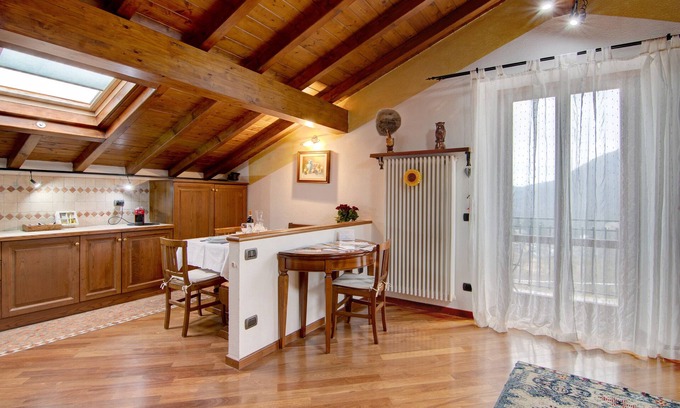 Lanzo d'Intelvi Apartment | Apartment "La Mansarda di Eros e Tiziana" with Mountain View, Shared Garden & Wi-Fi