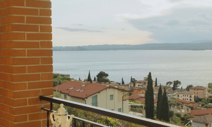Torri del Benaco Apartment | Apartment with splendid lake view a few steps from the center and the beach.