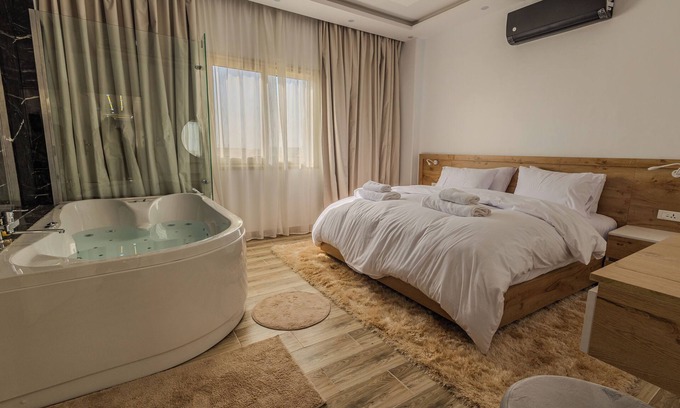 New Cairo Apartment | AUC Jacuzzi, Chic + Cozy Retreat with WiFi, AC
