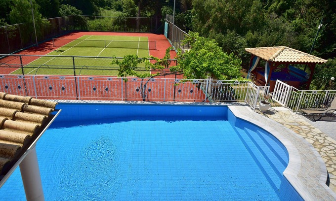 Roda Villa | Beachfront Family Luxury Villa Jolie: tennis, pool, jacuzzi, sauna, ping-pong.