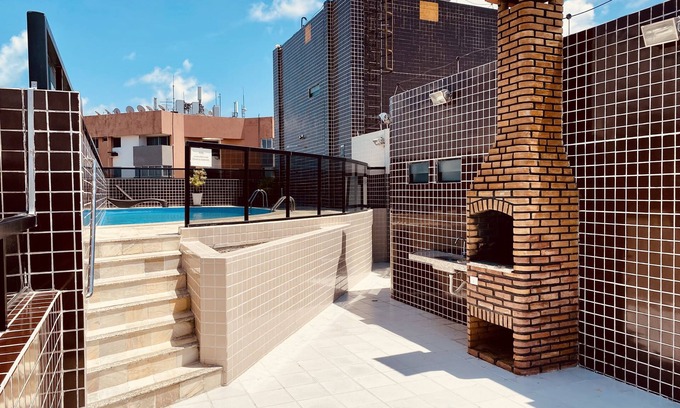 Ponta Verde Apartment | Bedroom and living room with pool near the beach