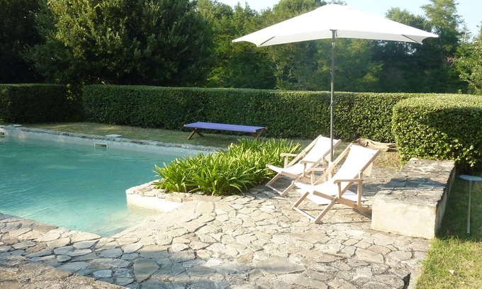 Santa Vittoria in Matenano Villa | Casale Oliva in a landscape of oaks, olives and cherry trees.