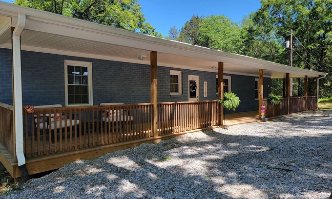 Chester House | Charming brick home set in the woods on 45 acres with pond and trails.