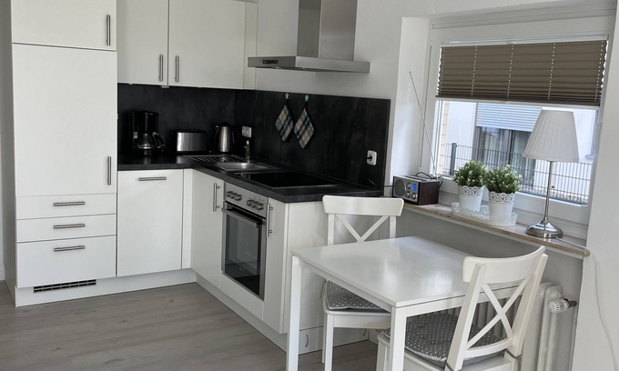 Scharbeutz Apartment | Comfortable apartment with terrace and outdoor pool right by the sea in Scharbeutz