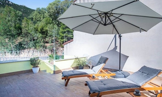 Guspini House | Comfortable room with private balcony and view