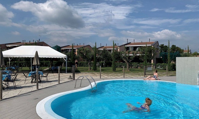 Moniga del Garda Apartment | Cosy apartment for 2 guests with WIFI, pool, A/C, TV, balcony and pets allowed