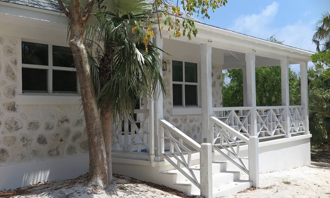 Double Bay Cottage | Cozy stone studio cottage on private pink sand beach
