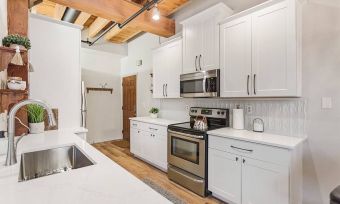 Grand Haven Condo | DOWNTOWN WATER VIEW PRIVATE BALCONY! 2 bedroom 1 bath w/large jacuzzi tub