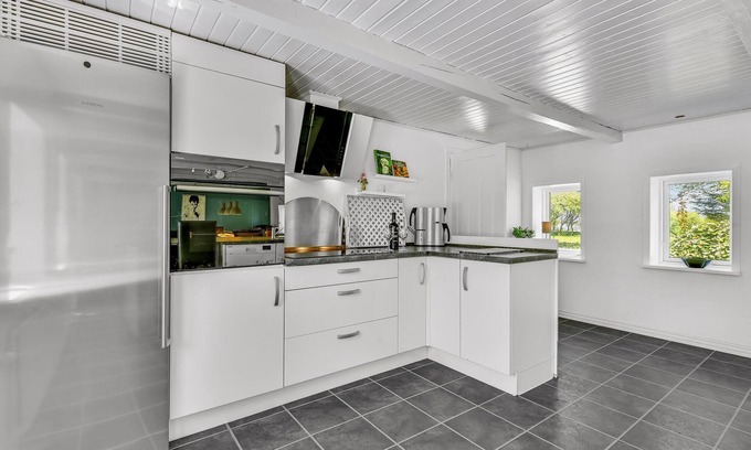 Thisted House | Enjoy a wonderful vacation in the bright and modern rooms of this vacation home.