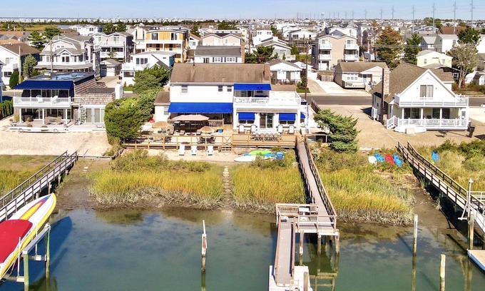 Avalon House | ENJOY BAY VIEWS! Bayfront home, shady front porch 2 boat docking areas, gameroom to watch TV, A short bike ride or walk to Avalon's fine business district for ice cream, dining, mini golf, shopping and more.