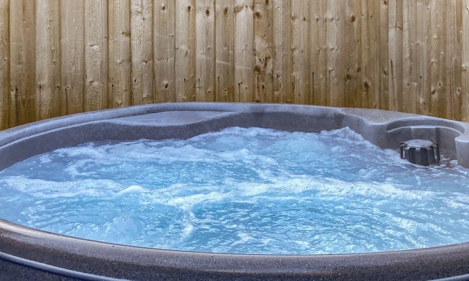 Addingham Cottage | Escape to a charming Addingham retreat featuring a private hot tub.
