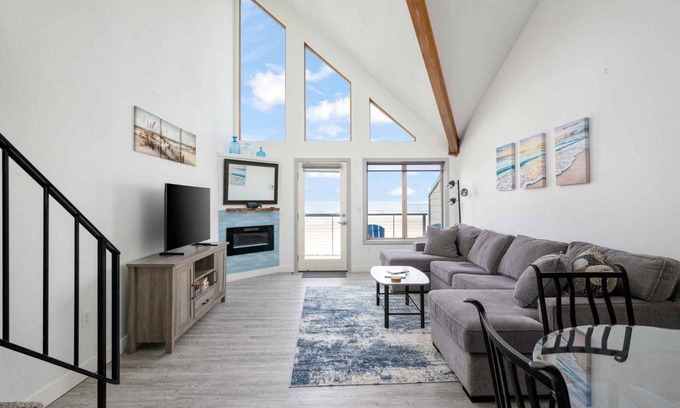 Rockaway Beach Condo | Exquisite Oceanfront and Beach Views at Rockaway Creek Inn, Patio and Living Bathed In Natural Light
