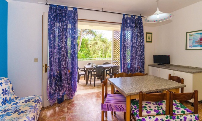 Bibione Pineda Apartment | Gabbiano tree-room flat surrounded by the green of the quite pine forest